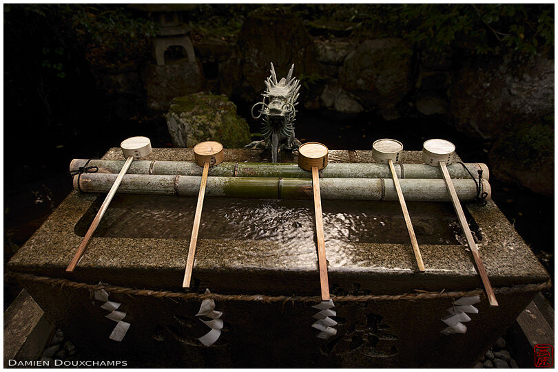 Washbasin with dragon fountain in Kuwayama shrine, Kyoto, Japan