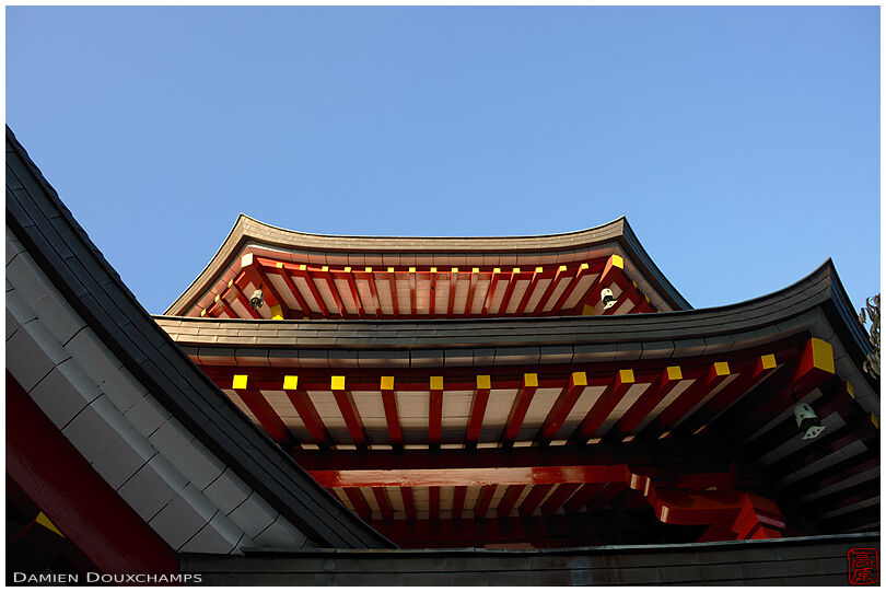 Clean temple roof lines and blue shy on sunny autumn day in Koyasan, Japan