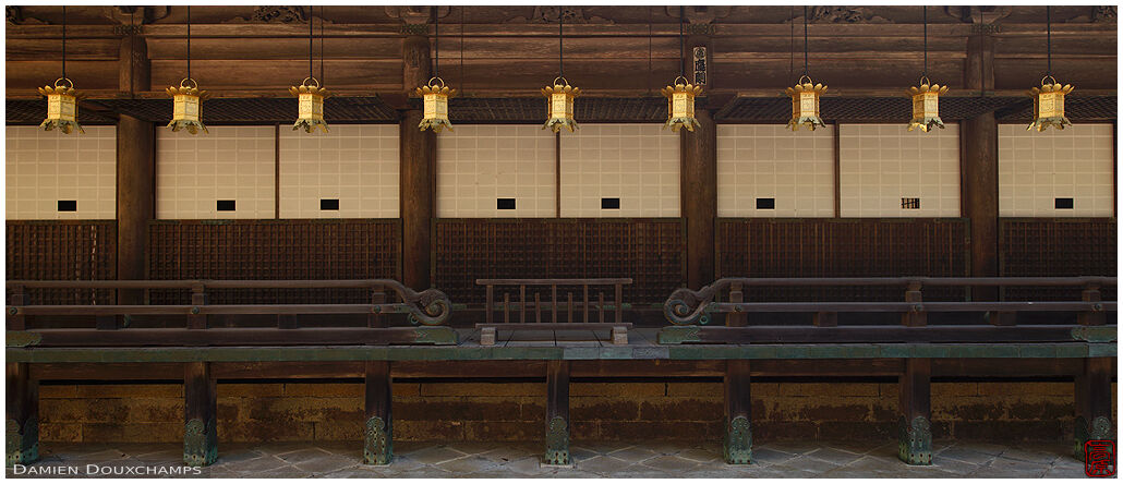 Row of golden lanterns around temple hall, Koya-san, Japan