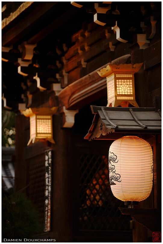 Lanterns lighting up the front gate of Kitano Tenmangu shrine, Kyoto, Japan