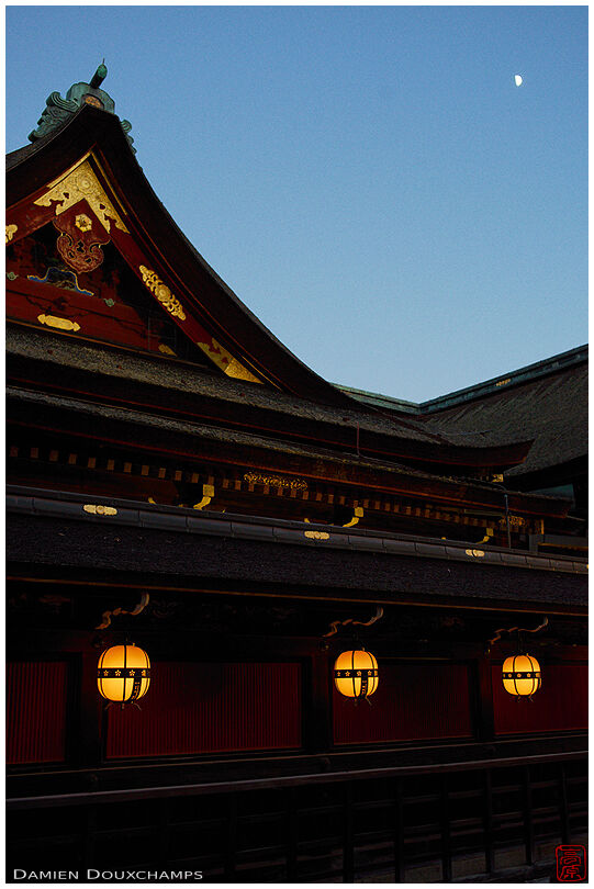 Lanterns around the heart of Kitano Tenmangu shrine with a little visit from the moon, Kyoto, Japan