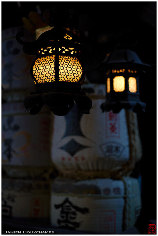 Two lanterns and sake barrels in Kitano Tenmangu shrine, Kyoto, Japan