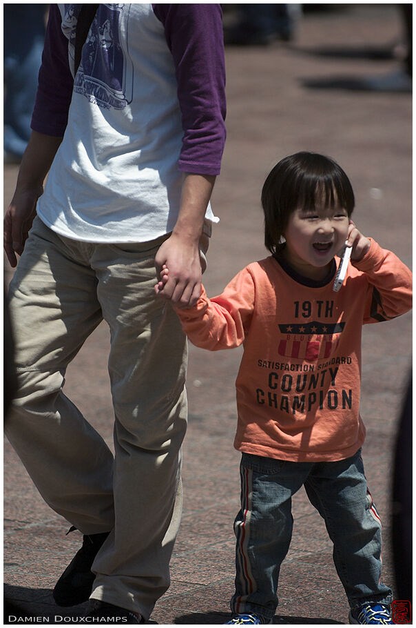 Kid talking on a mobile phone, Shibuya