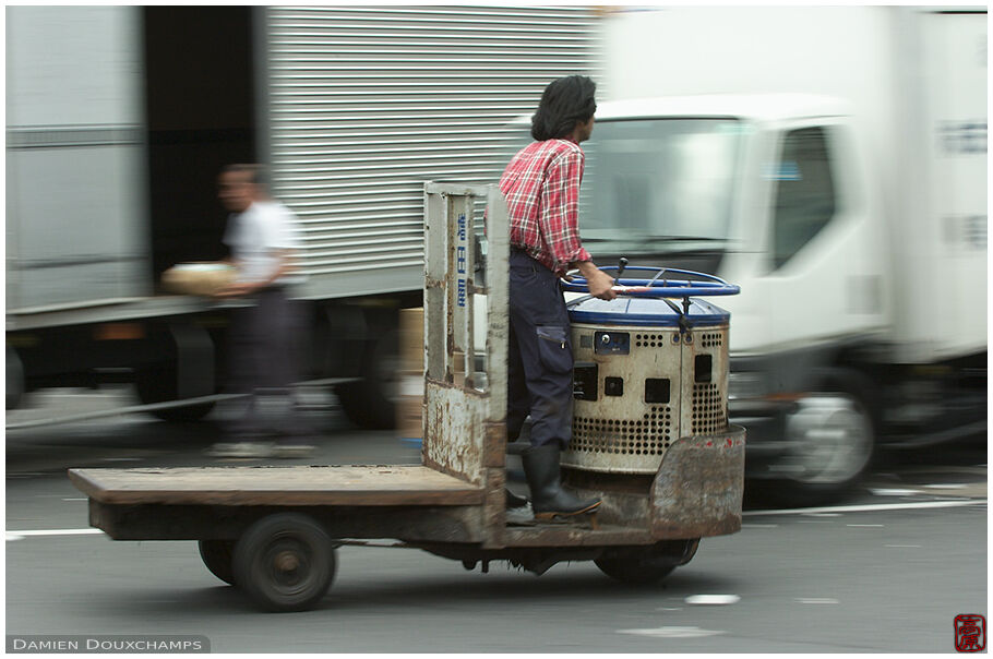 Riding a toretto in Tsukiji fish market, Tokyo