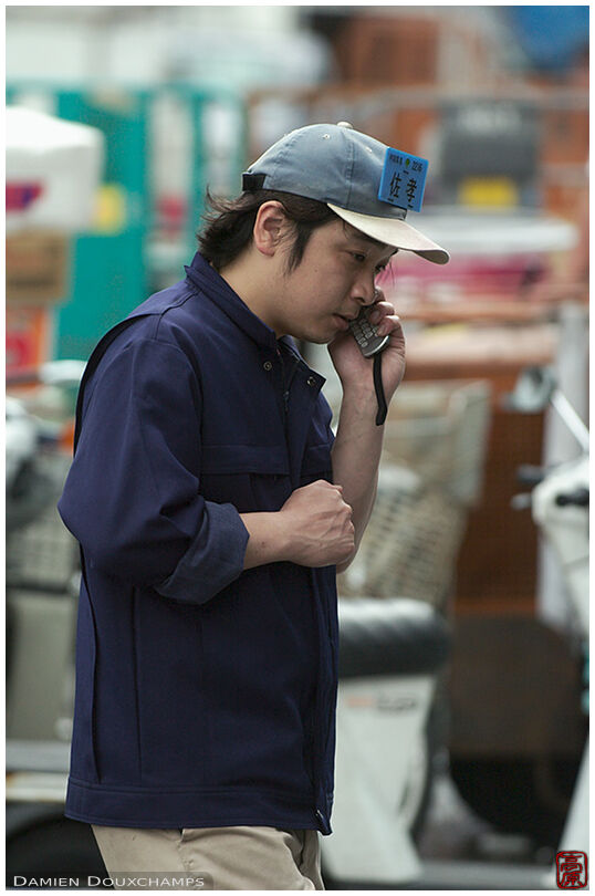 Auction buyer on the phone at the Tsukiji market, Tokyo