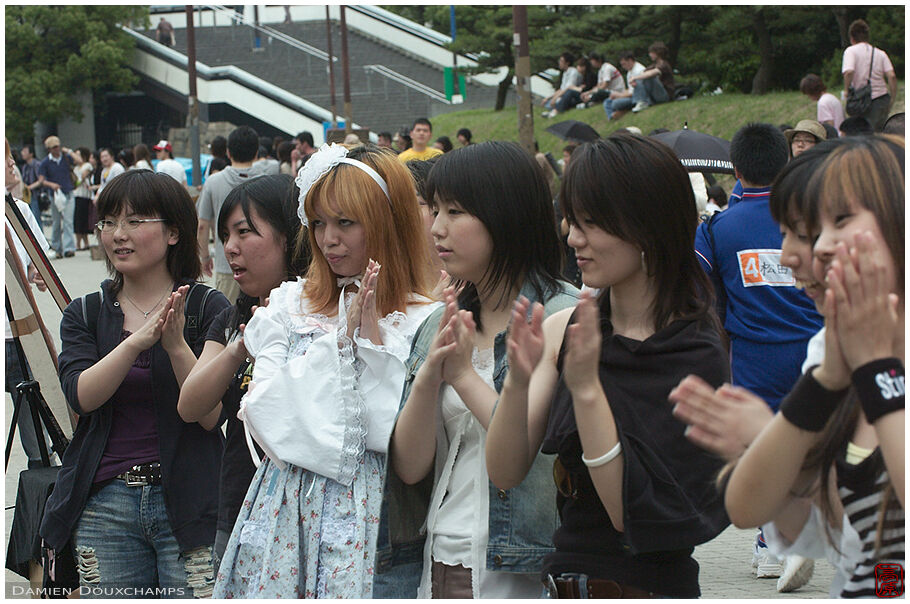 Girls actively listening to a rock concert in Osakajoo koen