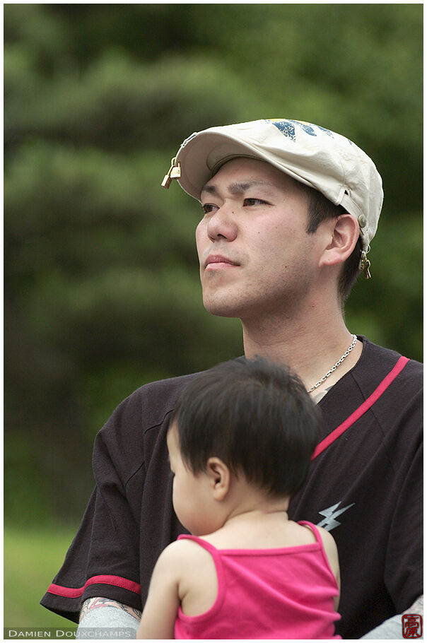 Singer and daughter listening to another band