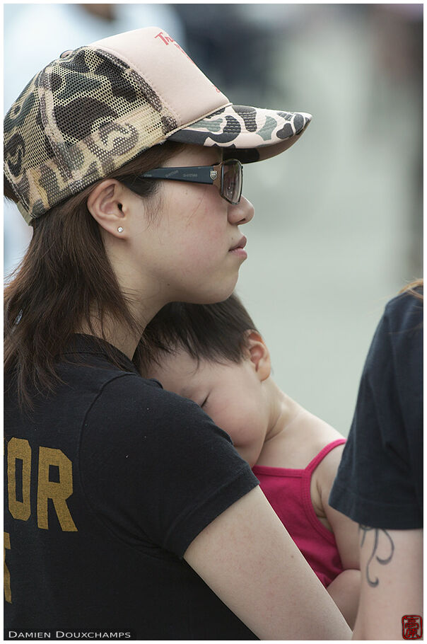 Mother and kid listening to a signing to a hardcore dad