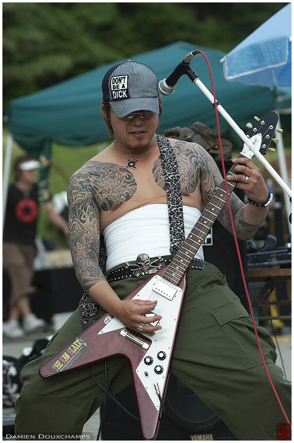 Tattooed hardcore guitar player