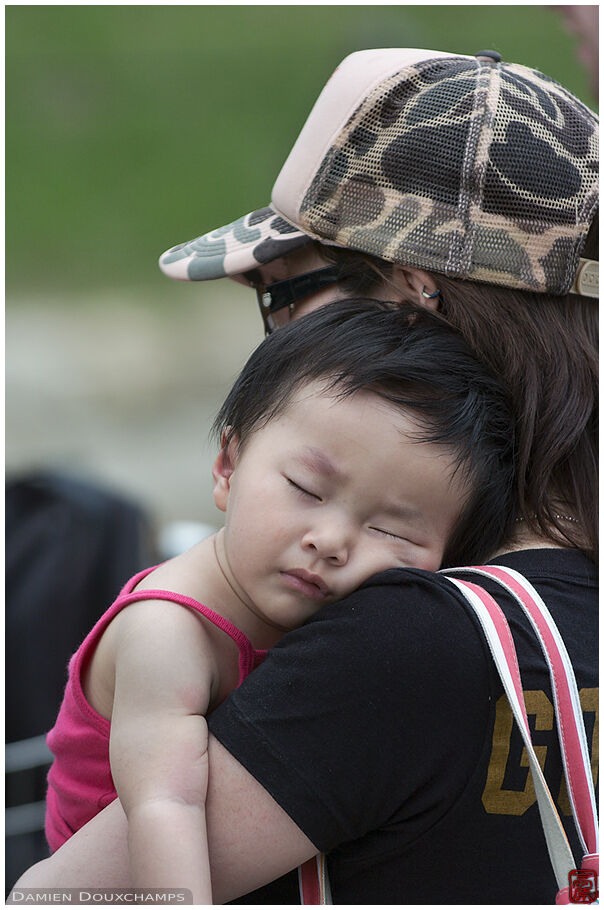 Mum and kid listening to a hardcore band