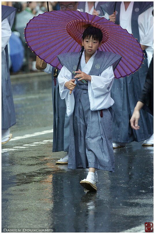 Kid with purple umbrella