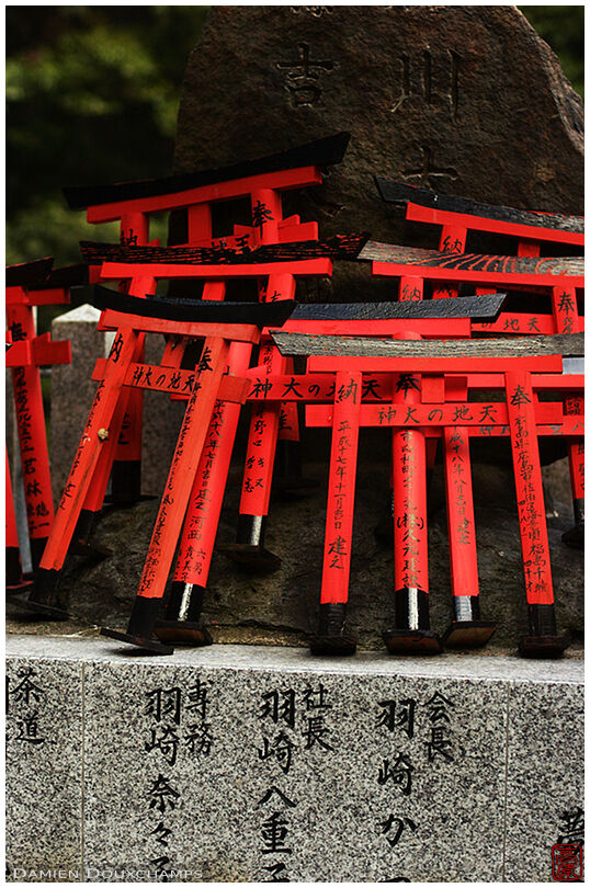 Miniature torii at the foot of a sacred stone