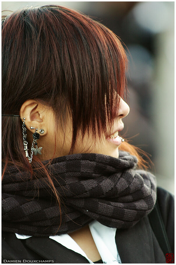 Girl with a black-rose-and-butterfly earring