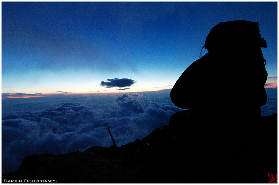 Hiker watching sunrise