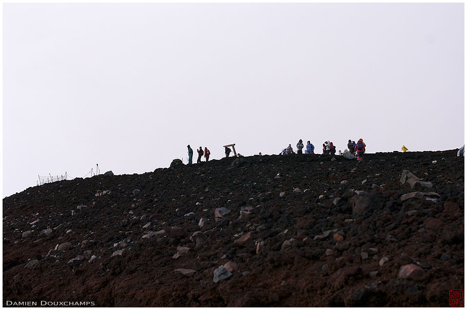 Hikers in the rocky distance