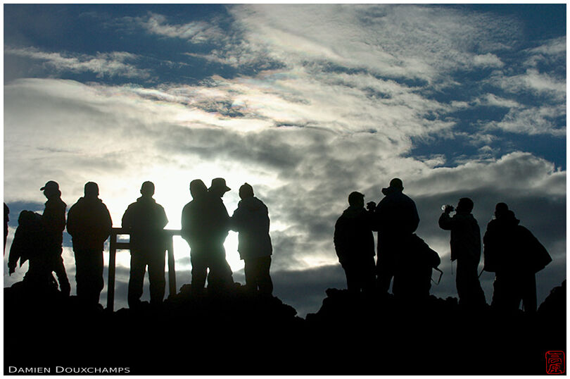 Climbers attending the sunrise near the summit