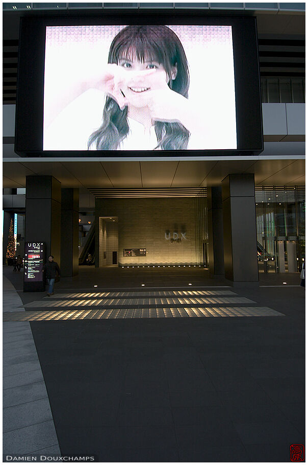 Smiling girl on a jumbotron